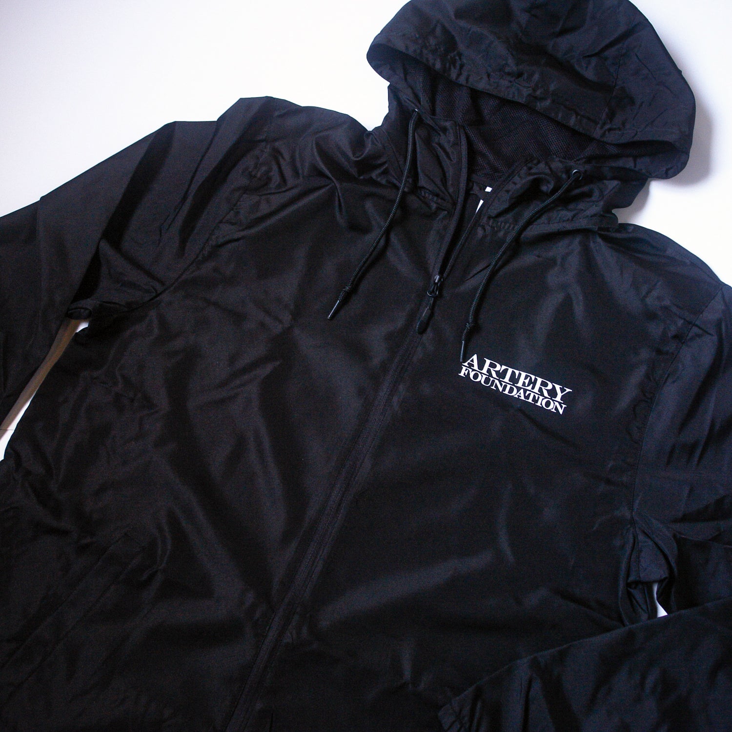 Logo - Black Zip-Up Windbreaker – MerchNow