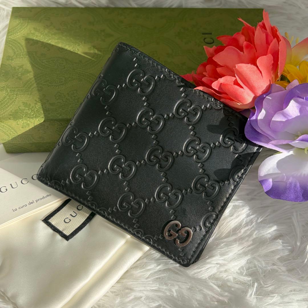 未使用級✨️ グッチ　二つ折り　シマ　小銭入れ　ドリアン　型押し　レザー　黒 グッチ GUCCI 779836 CWC1N 1000 二つ折り財布 ブラック スリム 黒