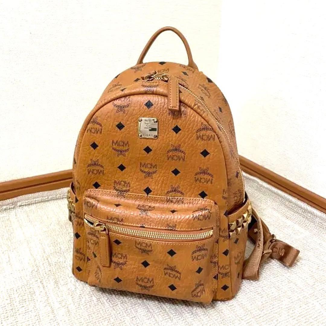 【美品】MCM リュック・バックパック 中型 ブラウン 保存袋付き MCM エムシーエム サイドスタッズ 付き バックパック リュック